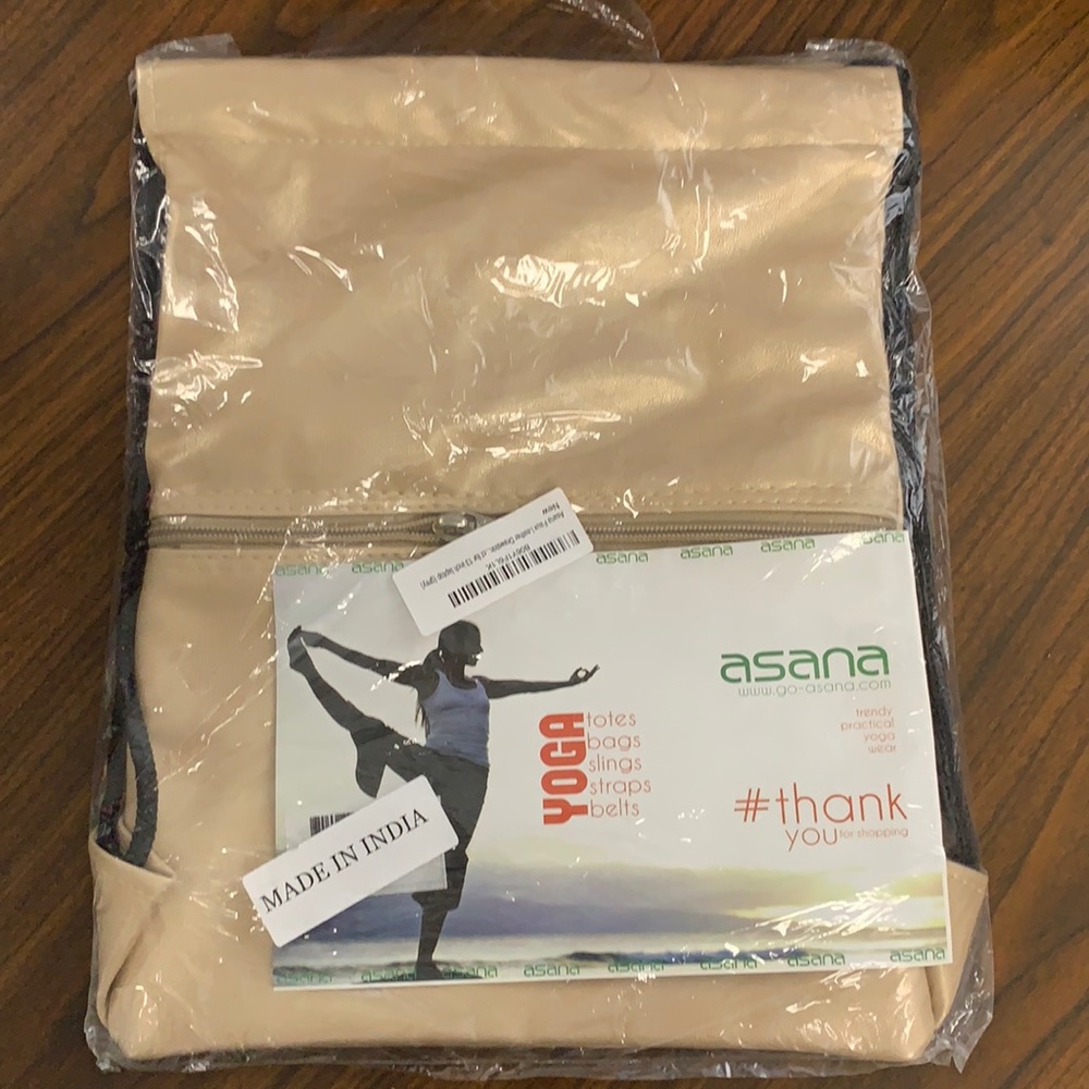 Champagne shimmer faux leather drawstring bag.